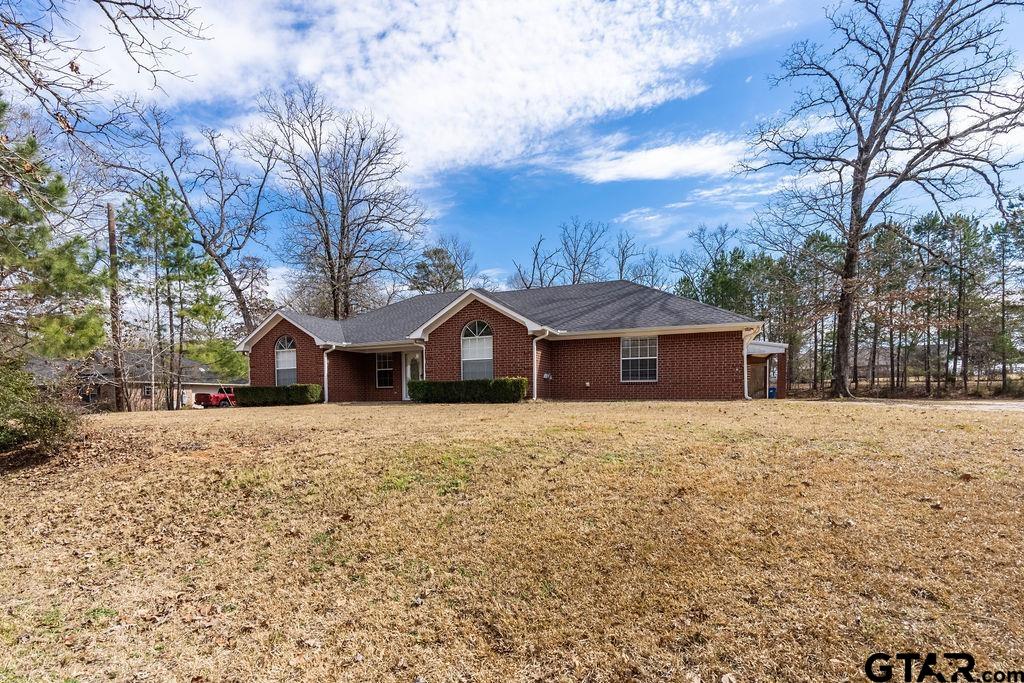 360 Anderson County Road Palestine, TX 75803 - Photo 12 of 41 a front view of a house with a yard covered in snow