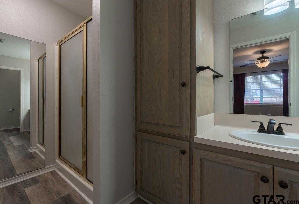 360 Anderson County Road Palestine, TX 75803 - Photo 20 of 41 a bathroom with a sink and a mirror