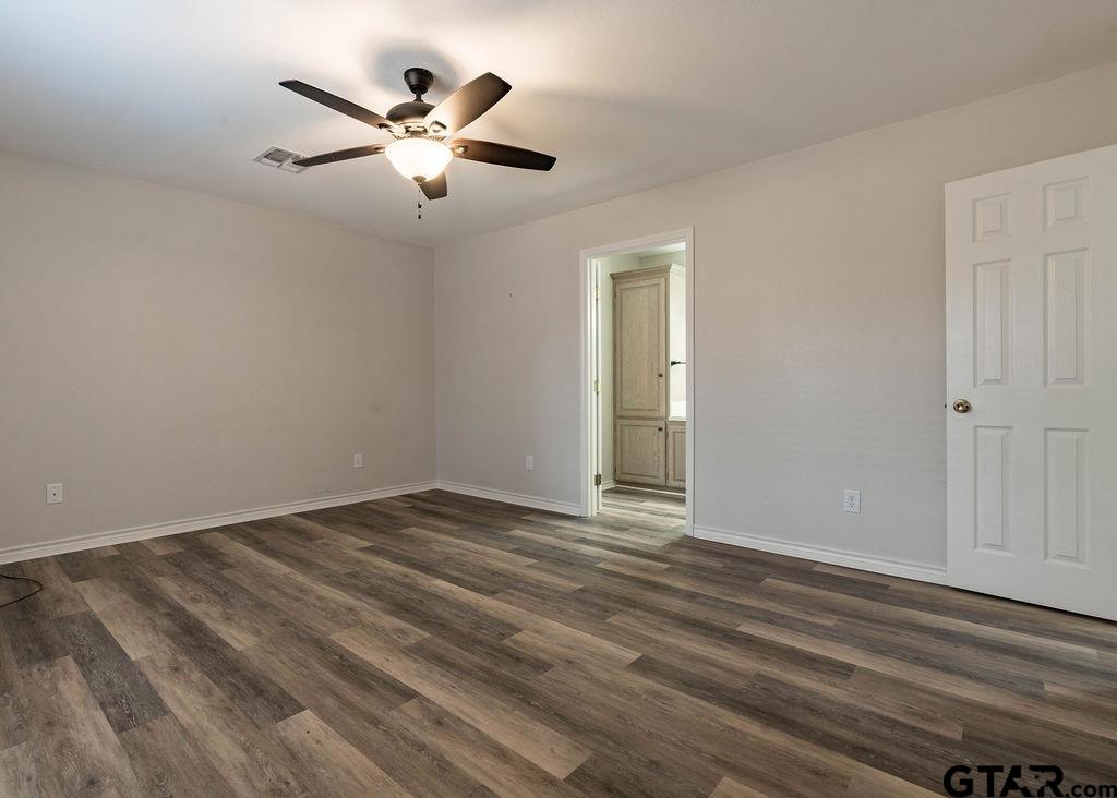 360 Anderson County Road Palestine, TX 75803 - Photo 40 of 41 a view of an empty room with wooden floor