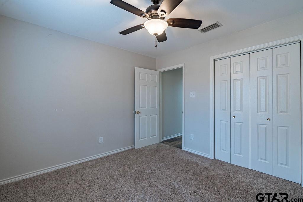 360 Anderson County Road Palestine, TX 75803 - Photo 4 of 41 a view of an empty room and chandelier fan