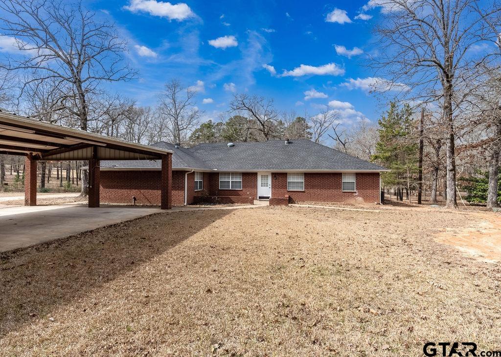 360 Anderson County Road Palestine, TX 75803 - Photo 7 of 41 a front view of a house with a yard and garage