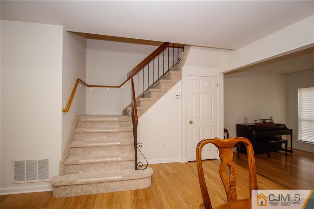 1705 Timber Oaks Road, Unit 1705 Edison, NJ 08820 - Photo 16 of 25 a view of entryway and hall with wooden floor