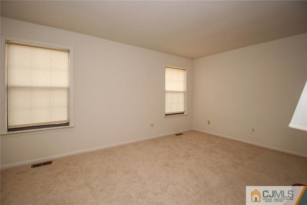 1705 Timber Oaks Road, Unit 1705 Edison, NJ 08820 - Photo 18 of 25 an empty room with windows