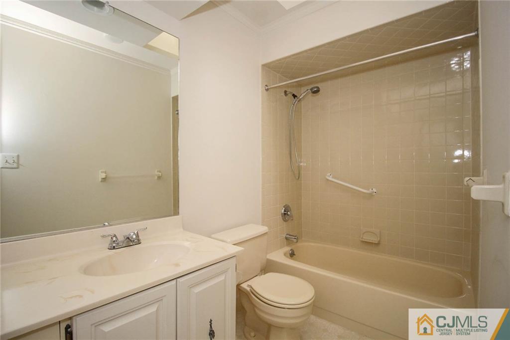 1705 Timber Oaks Road, Unit 1705 Edison, NJ 08820 - Photo 25 of 25 a bathroom with a sink toilet and shower