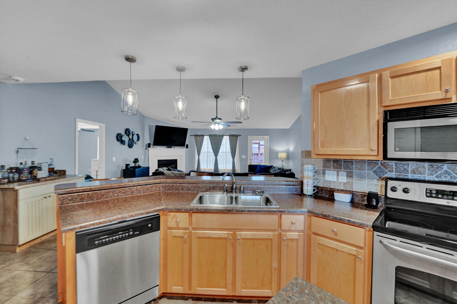 103 Citadel Lane Crestview, FL 32539 - Photo 12 of 41 a kitchen with stainless steel appliances granite countertop a stove sink and cabinets