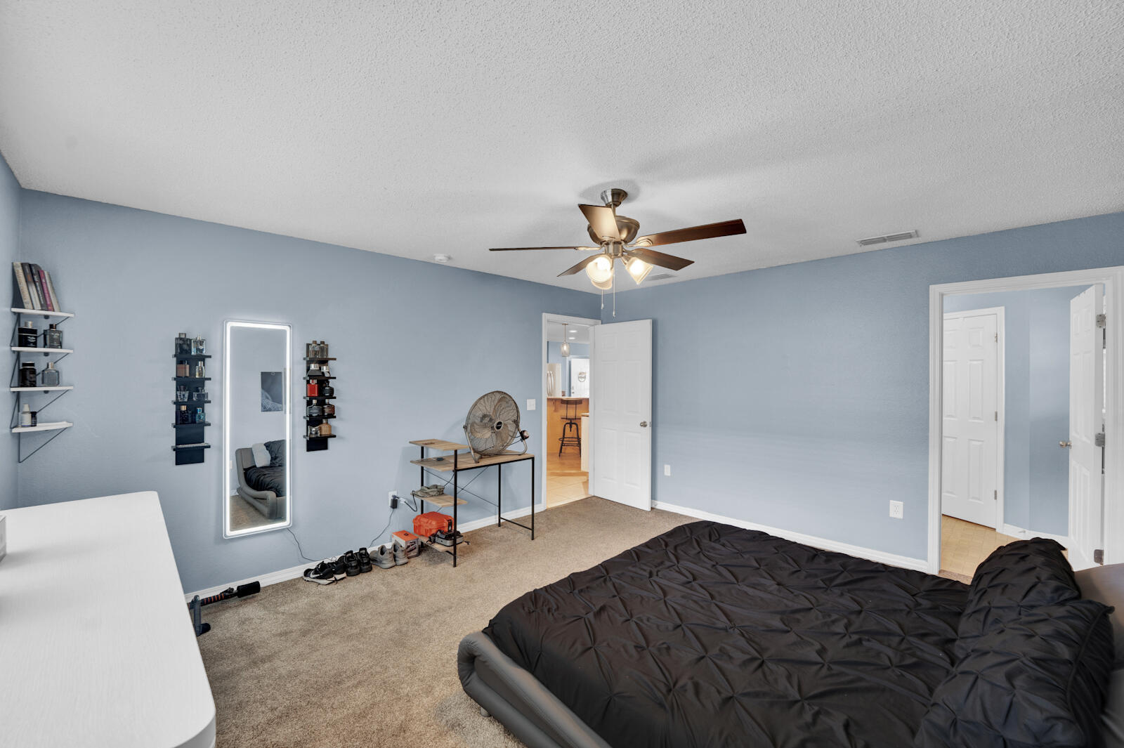 103 Citadel Lane Crestview, FL 32539 - Photo 16 of 41 a bedroom with a bed and wooden floor