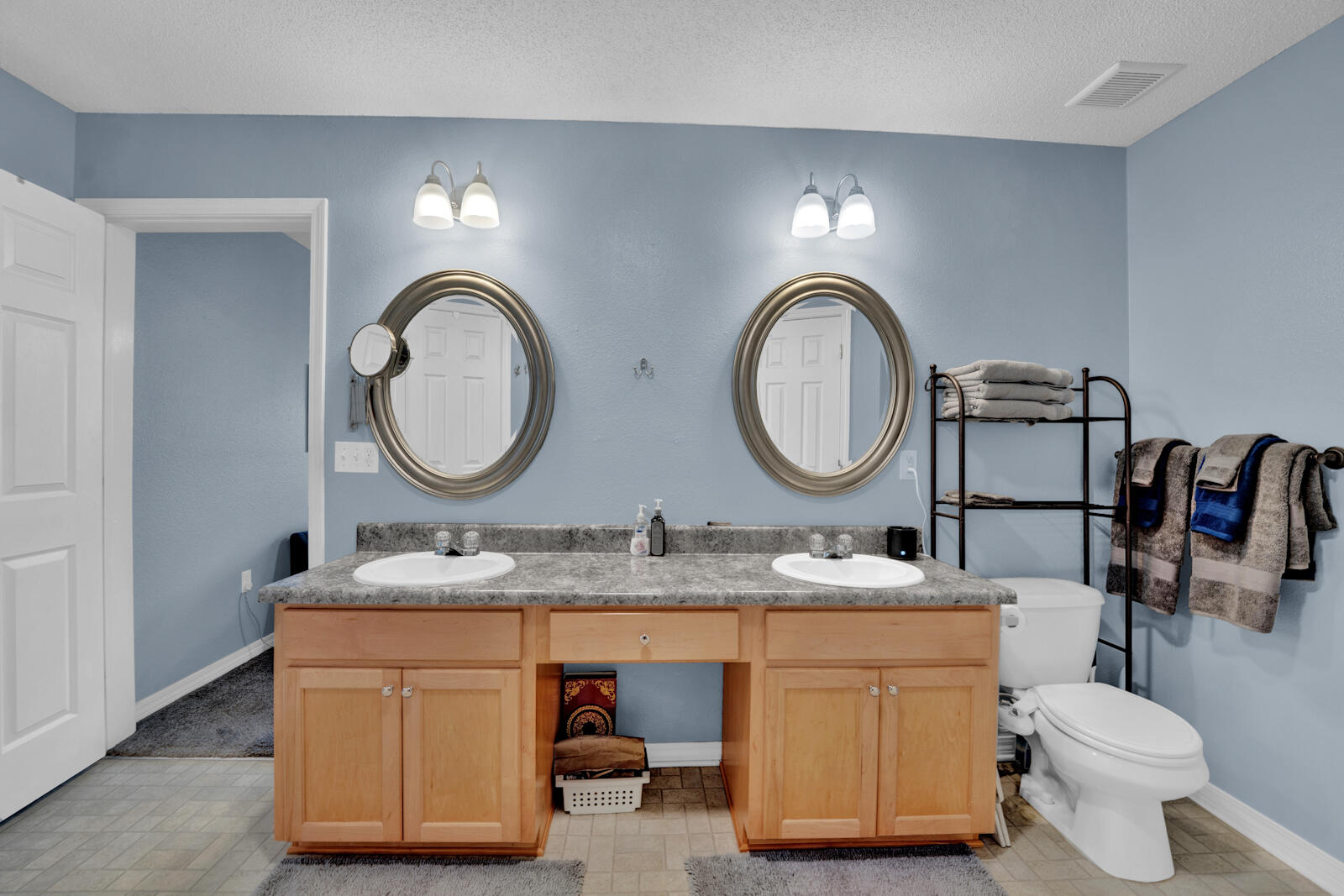 103 Citadel Lane Crestview, FL 32539 - Photo 18 of 41 a bathroom with a toilet a double vanity and a mirror
