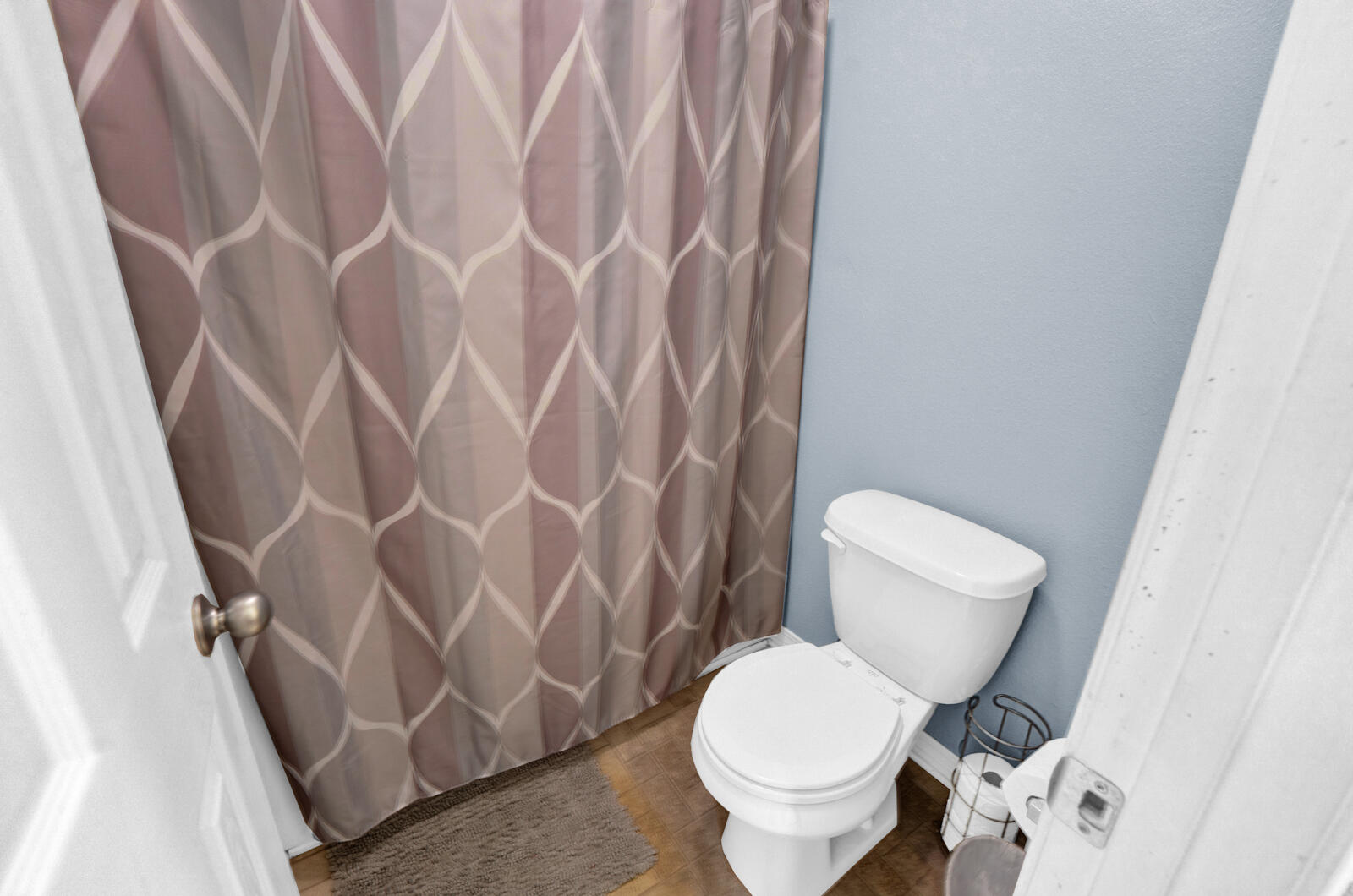 103 Citadel Lane Crestview, FL 32539 - Photo 19 of 41 a white toilet sitting next to a shower curtain