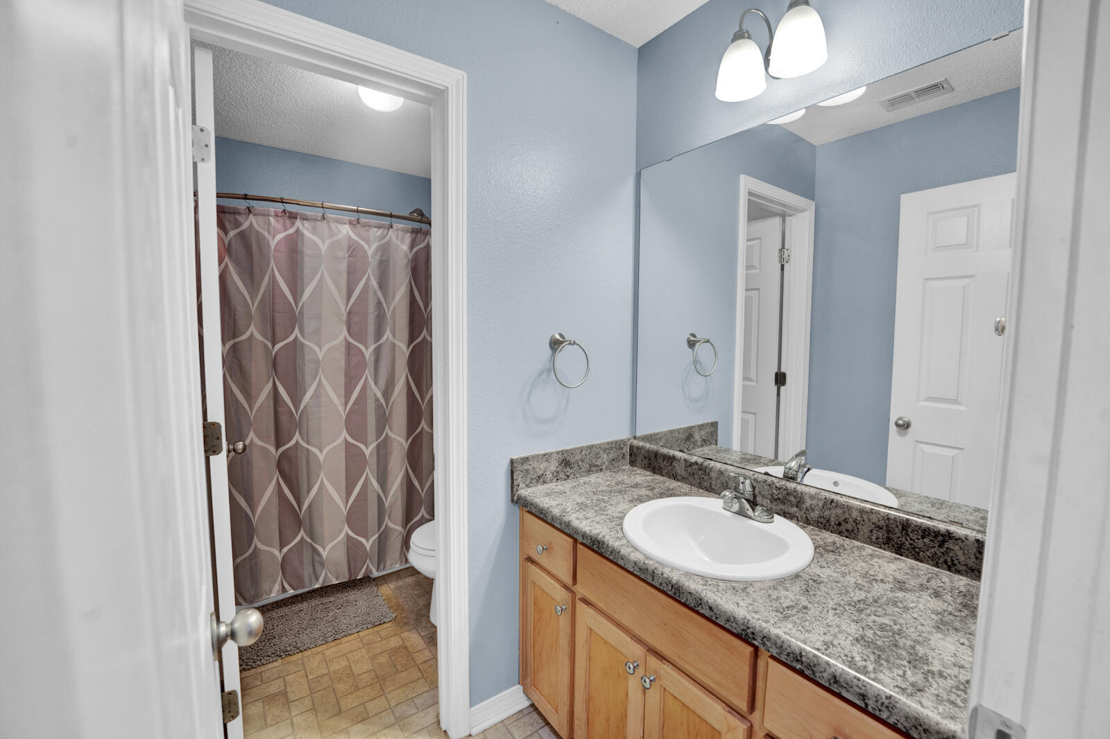 103 Citadel Lane Crestview, FL 32539 - Photo 22 of 41 a bathroom with a granite countertop sink and a mirror