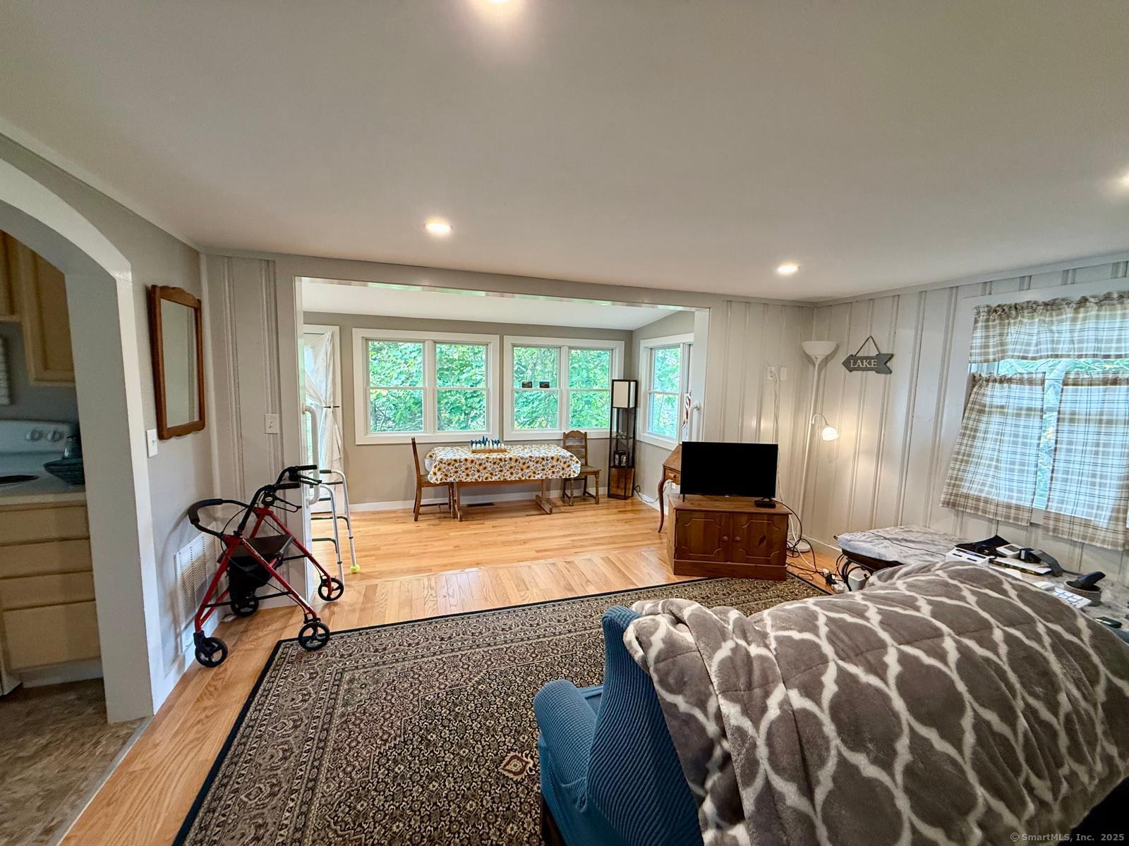 21 Boughton Road Old Lyme, CT 06371 - Photo 12 of 21 a bed room with a bed and a television