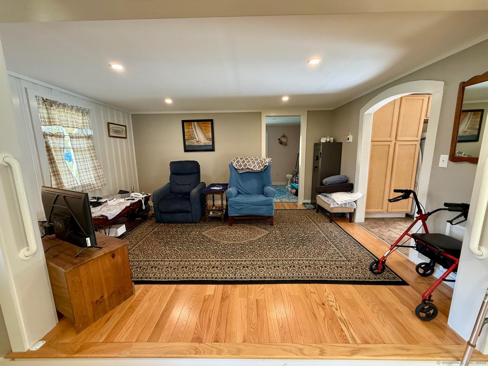 21 Boughton Road Old Lyme, CT 06371 - Photo 9 of 21 a living room with furniture and a flat screen tv