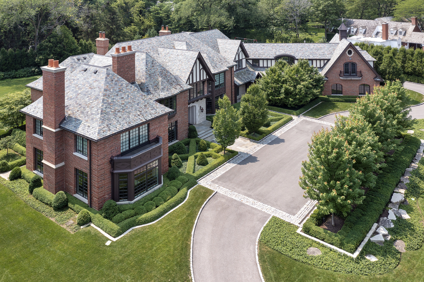 37 Woodley Road Winnetka, IL 60093 - Photo 2 of 66 a aerial view of a house with a yard and large trees