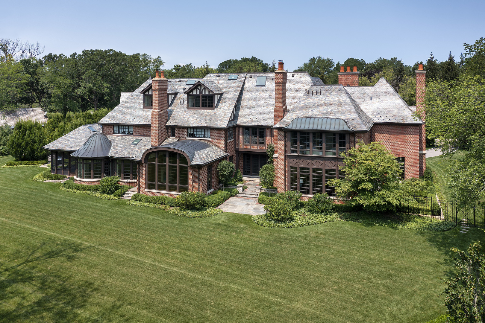 37 Woodley Road Winnetka, IL 60093 - Photo 12 of 66 a front view of a house with a garden
