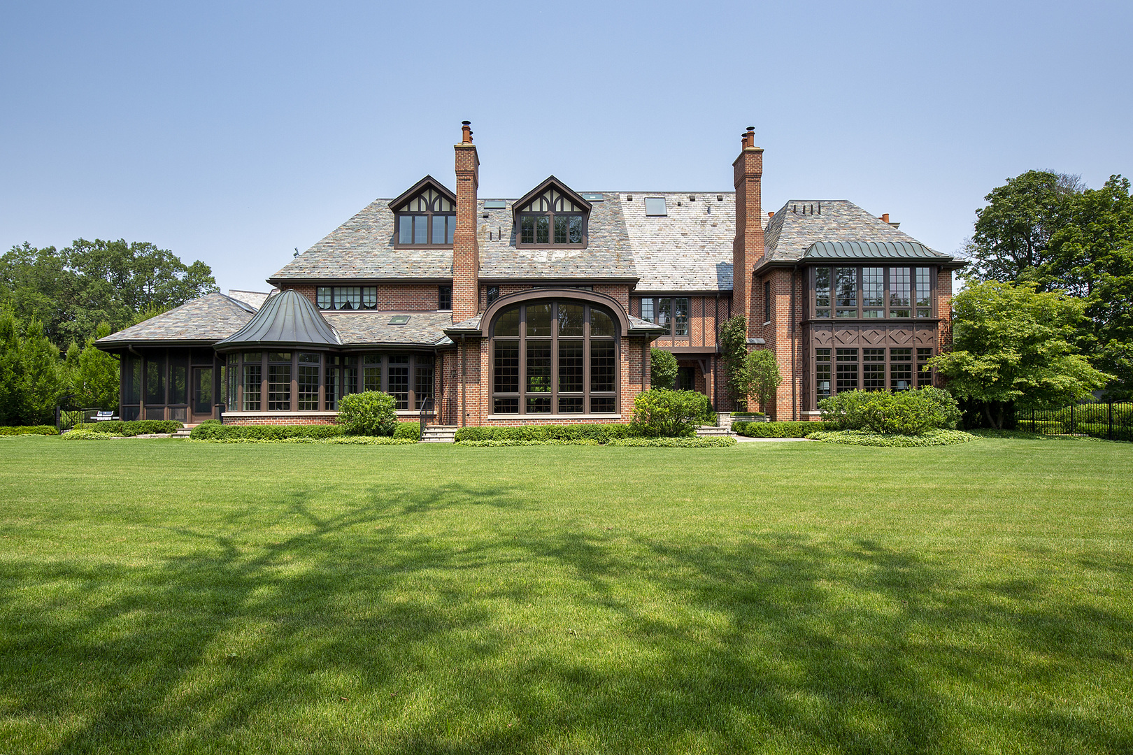 37 Woodley Road Winnetka, IL 60093 - Photo 13 of 66 a front view of a house with a garden