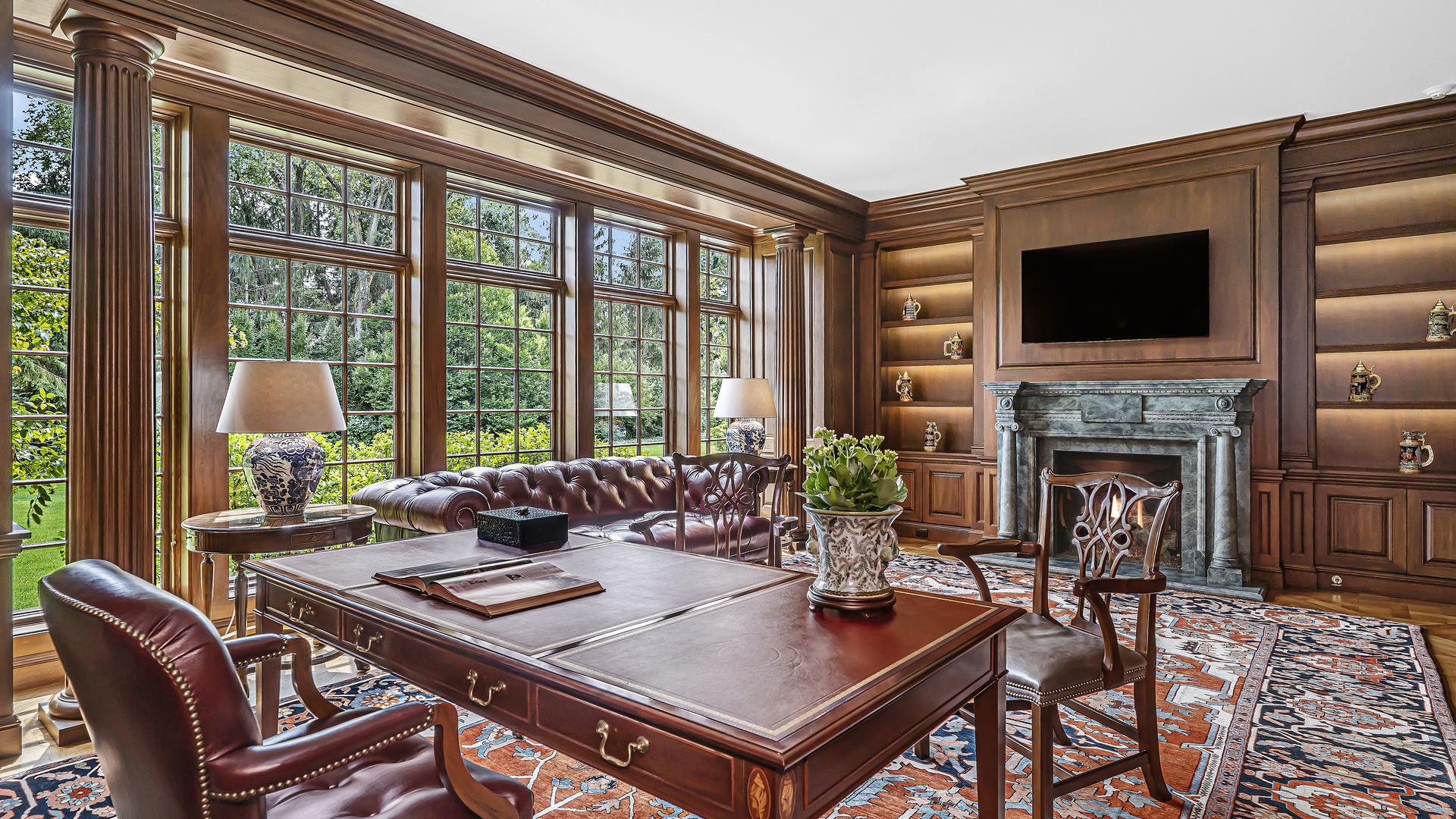 37 Woodley Road Winnetka, IL 60093 - Photo 28 of 66 a living room with furniture a large window and a fireplace