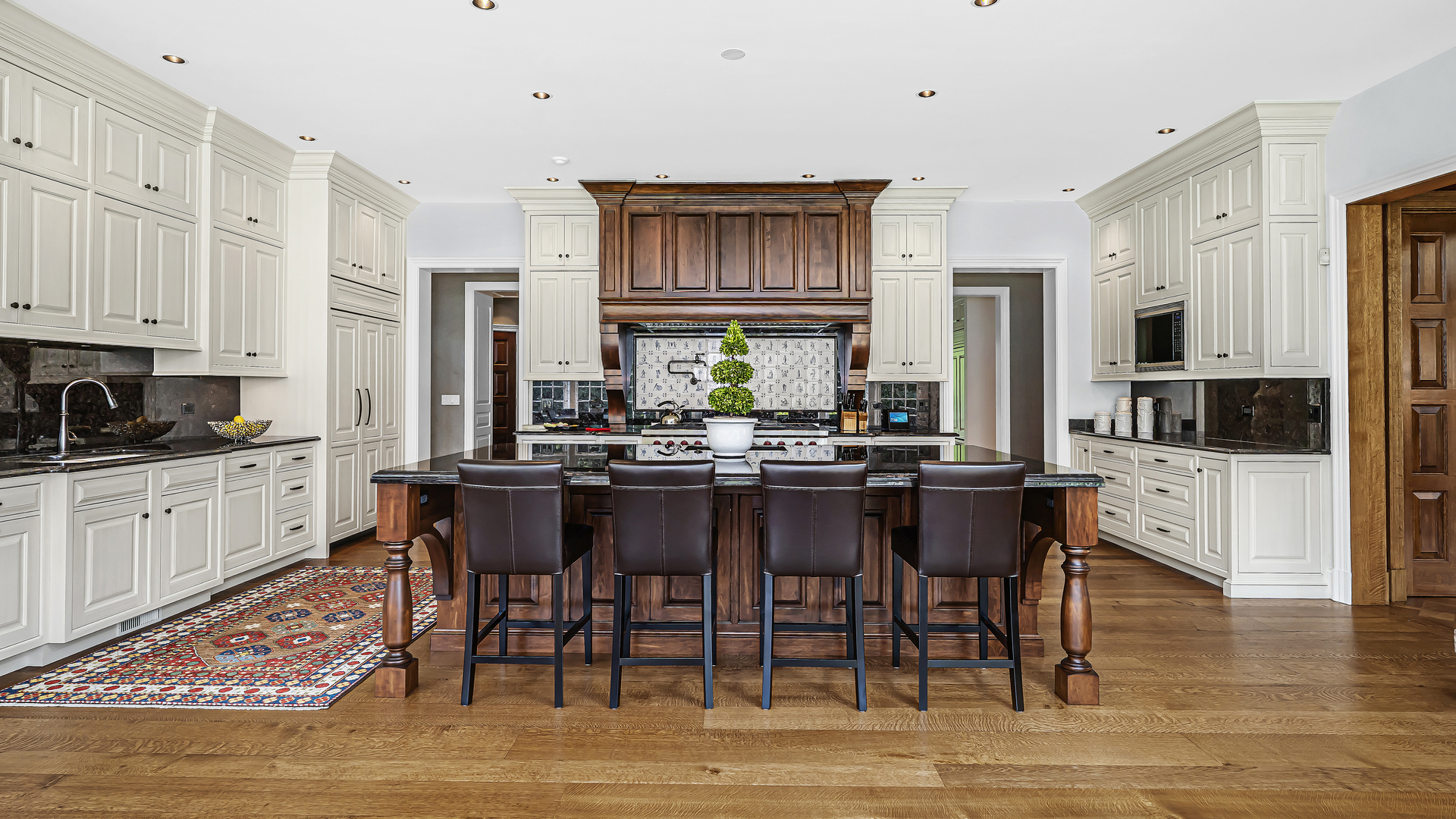 37 Woodley Road Winnetka, IL 60093 - Photo 36 of 66 a kitchen with stainless steel appliances a dining table and chairs