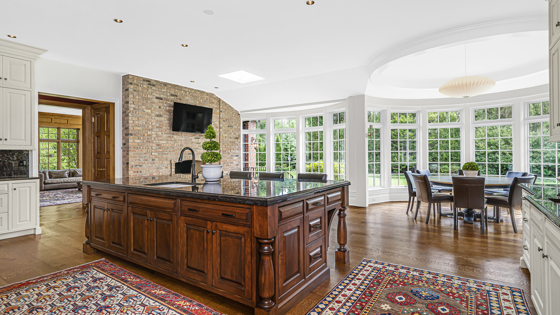 37 Woodley Road Winnetka, IL 60093 - Photo 37 of 66 a dining hall with stainless steel appliances granite countertop a stove and a dining table with garden view