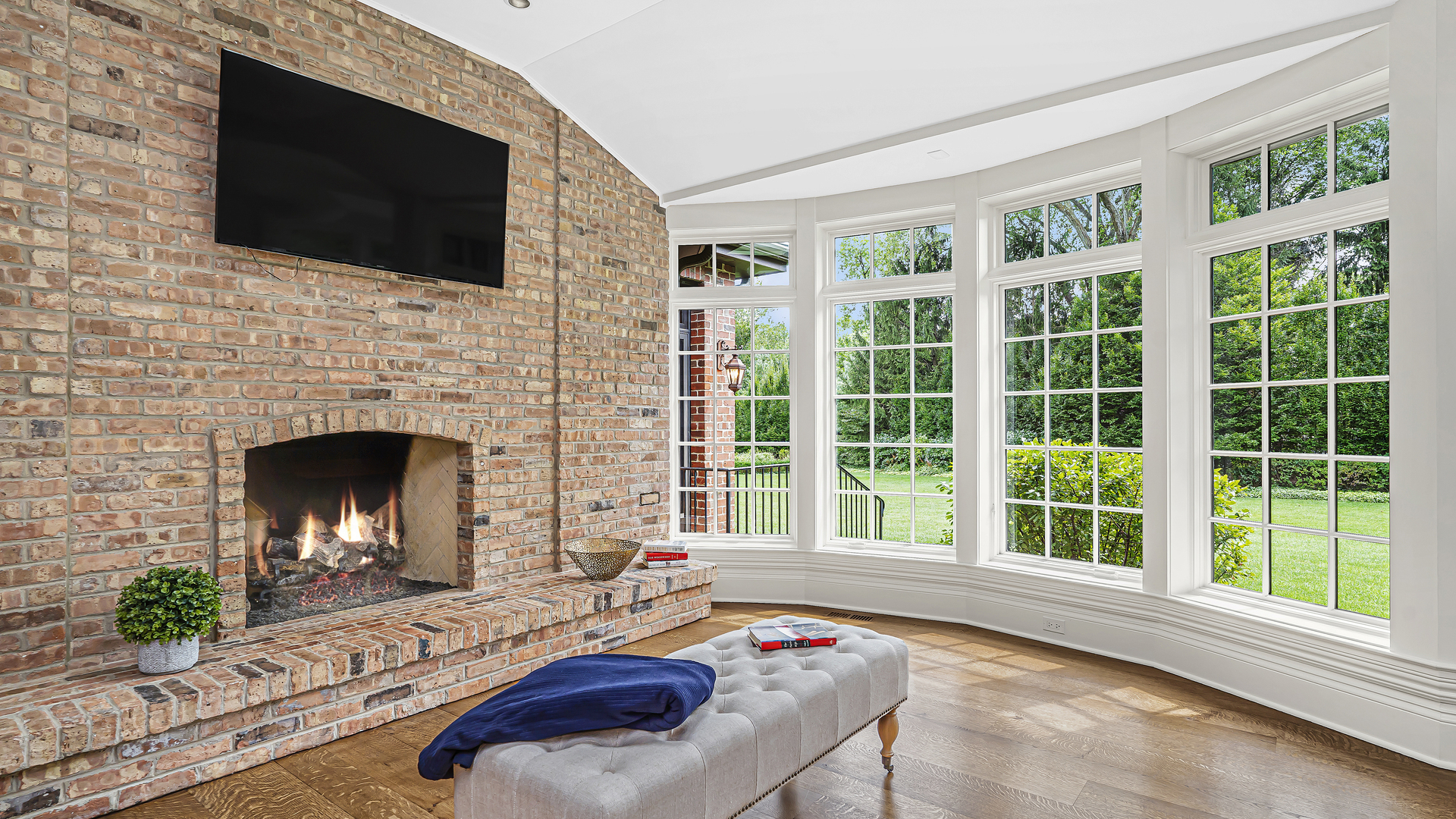 37 Woodley Road Winnetka, IL 60093 - Photo 38 of 66 a living room with furniture a fireplace and a flat screen tv