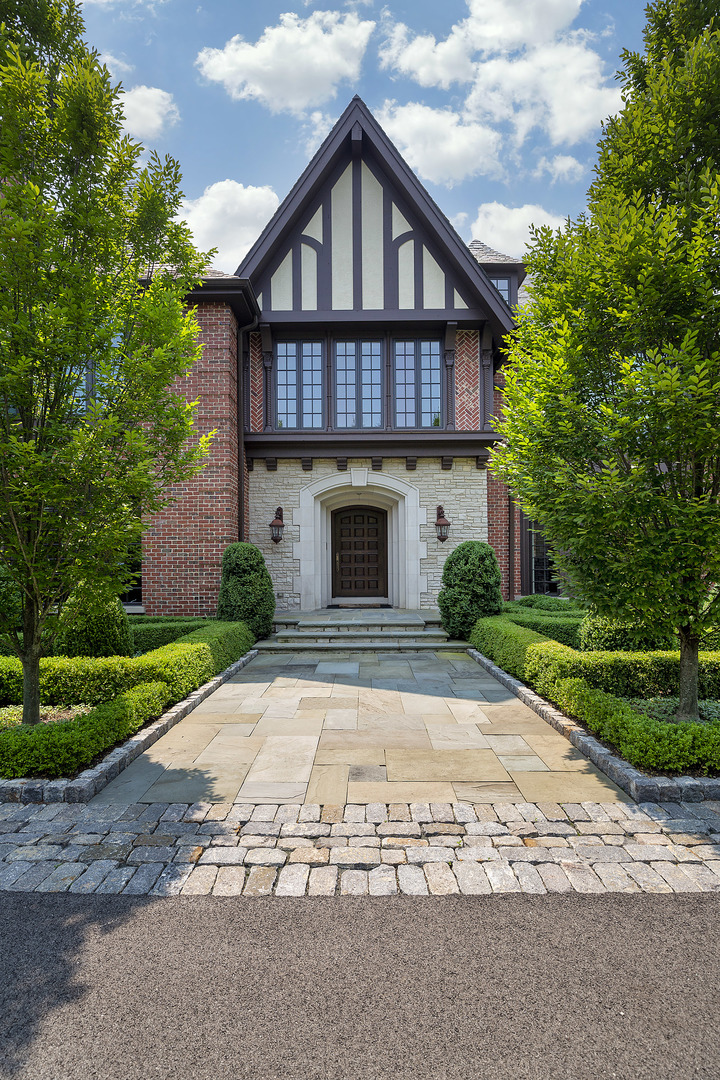 37 Woodley Road Winnetka, IL 60093 - Photo 5 of 66 a front view of a house with a yard