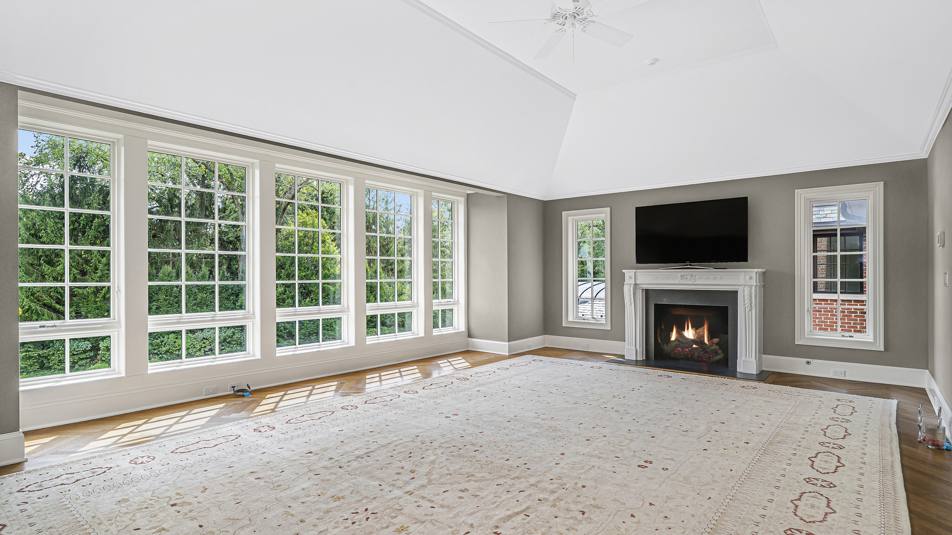 37 Woodley Road Winnetka, IL 60093 - Photo 45 of 66 a view of an empty room with a fireplace and a window