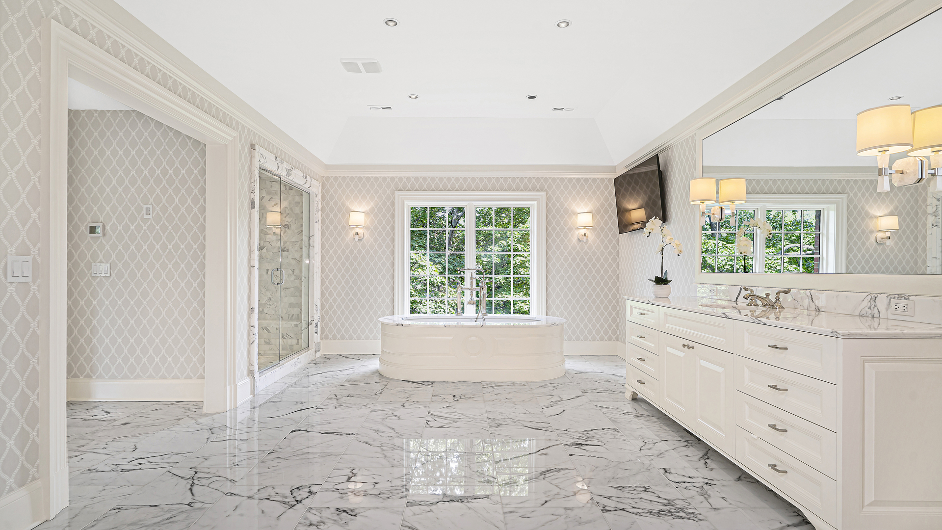 37 Woodley Road Winnetka, IL 60093 - Photo 47 of 66 a bathroom with a granite countertop sink a large mirror a bathtub and next to a window
