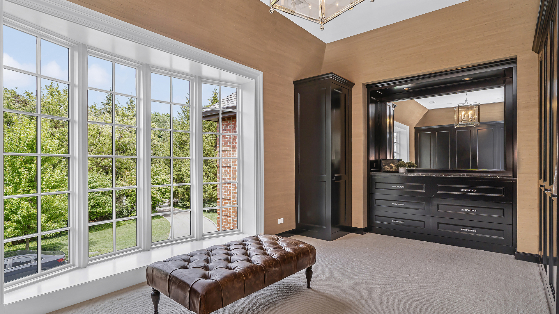 37 Woodley Road Winnetka, IL 60093 - Photo 50 of 66 a bedroom with a bed and a television