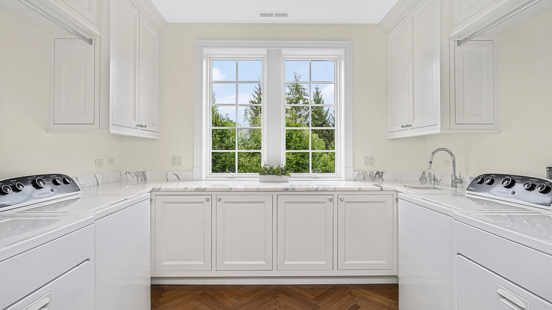 37 Woodley Road Winnetka, IL 60093 - Photo 54 of 66 a kitchen with stainless steel appliances granite countertop white cabinets and a window