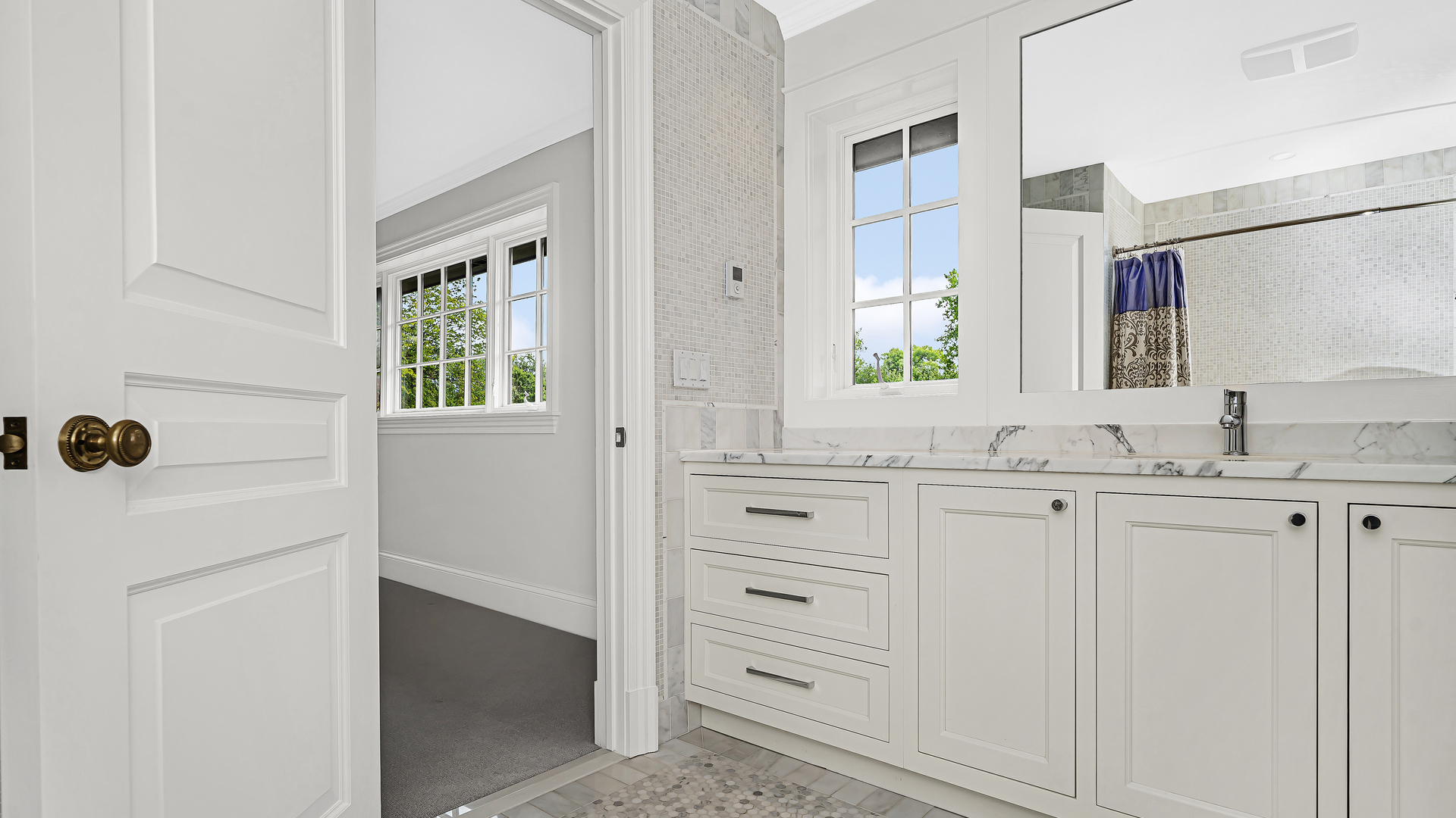 37 Woodley Road Winnetka, IL 60093 - Photo 56 of 66 a bathroom with a sink and a mirror