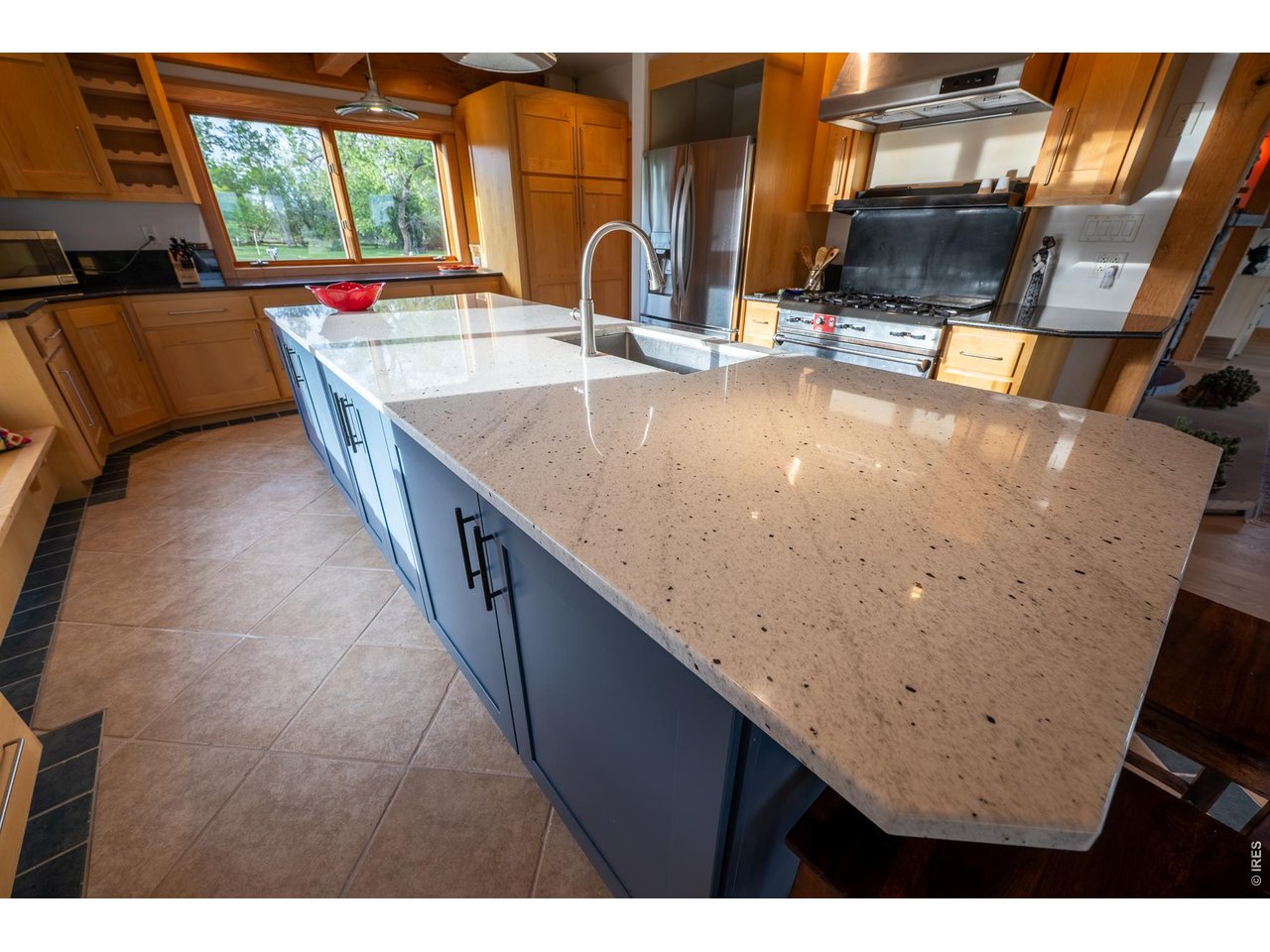4099 Michaud Lane Fort Collins, CO 80521 - Photo 35 of 50 Elegant granite countertops round out the kitchen, bringing a sense of timeless beauty and refined craftsmanship to the space.