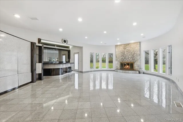 a view of open kitchen with kitchen island and stainless steel appliances