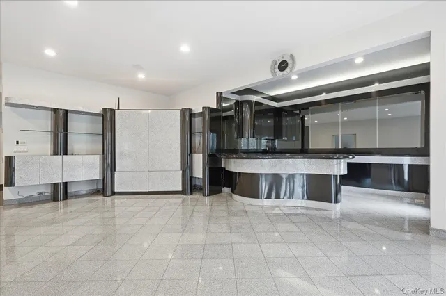 a large bathroom with a large tub and sink