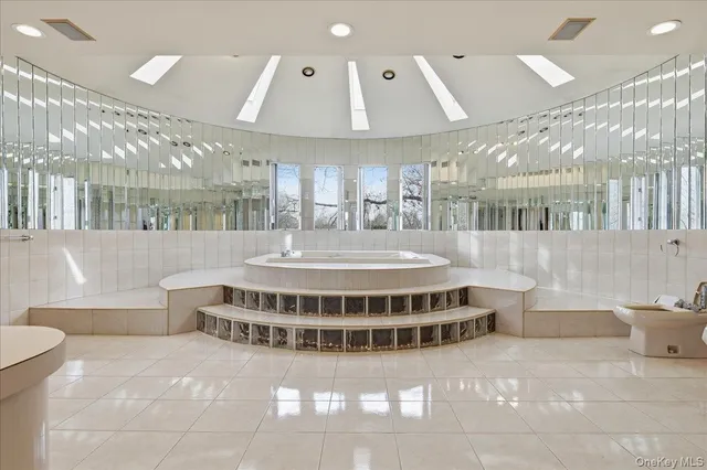 a view of a room with shelves and wooden shelves