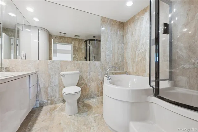 a bathroom with a toilet sink and bathtub
