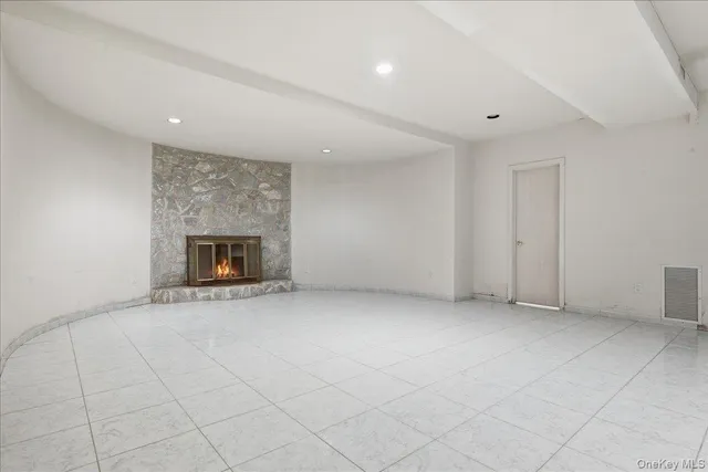 an empty room with fireplace