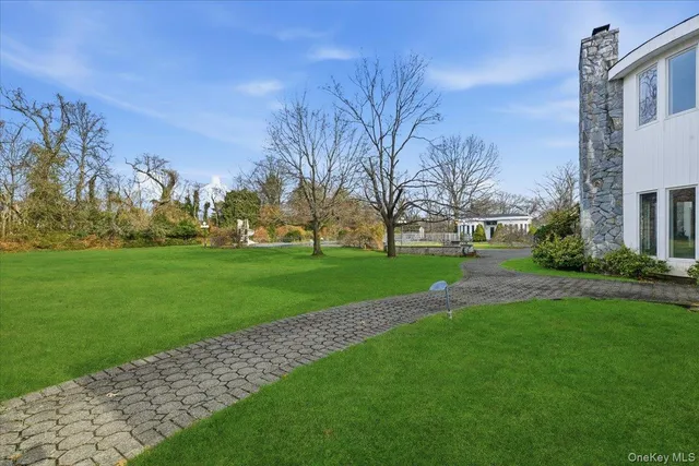 a view of a park with large trees