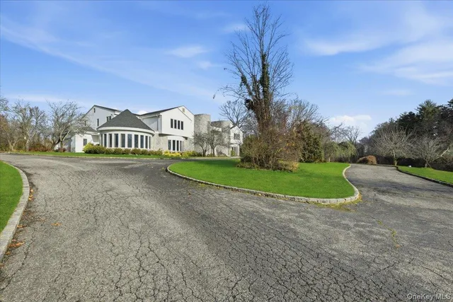 a view of street with houses and trees in the background