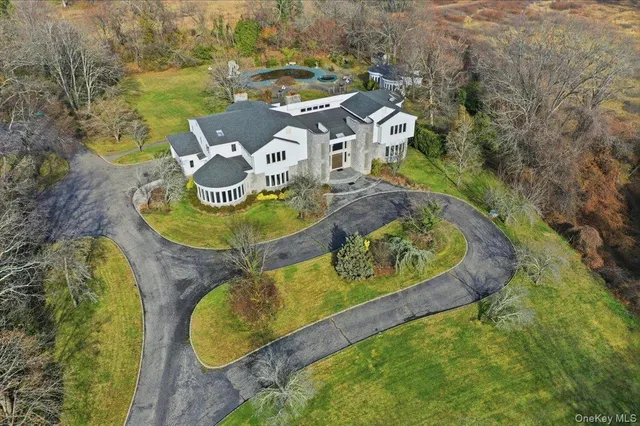 an aerial view of a house with a swimming pool
