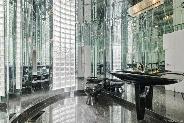 a view of a city from a dining room with chairs