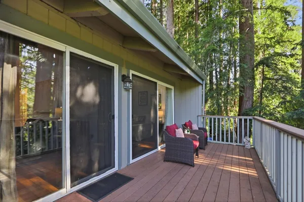 a view of house with yard entertaining space and potted plants