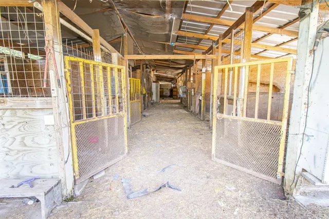 an aerial view of a house with a garden and lake view