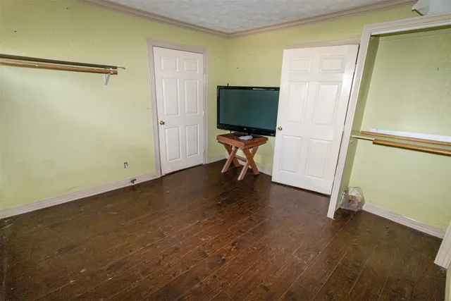a view of room with wooden floor and chair