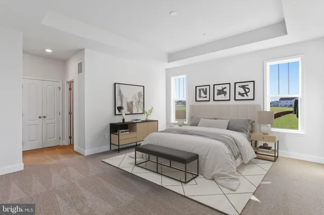 a bathroom with double sink and a mirror