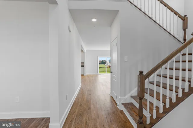 a kitchen with granite countertop a stove and a microwave