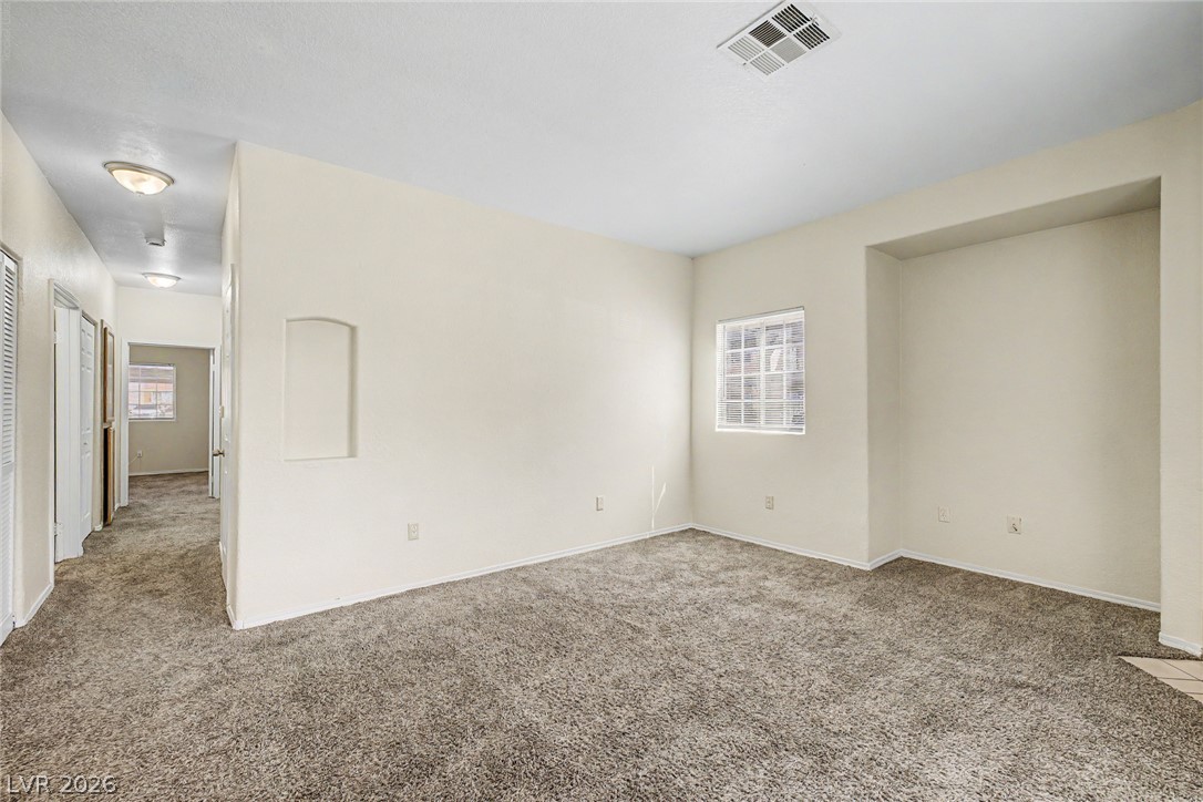 4730 East Craig Road, Unit 1091 Las Vegas, NV 89115 - Photo 7 of 23 Plush wall-to-wall carpeting and neutral walls define this versatile living space.