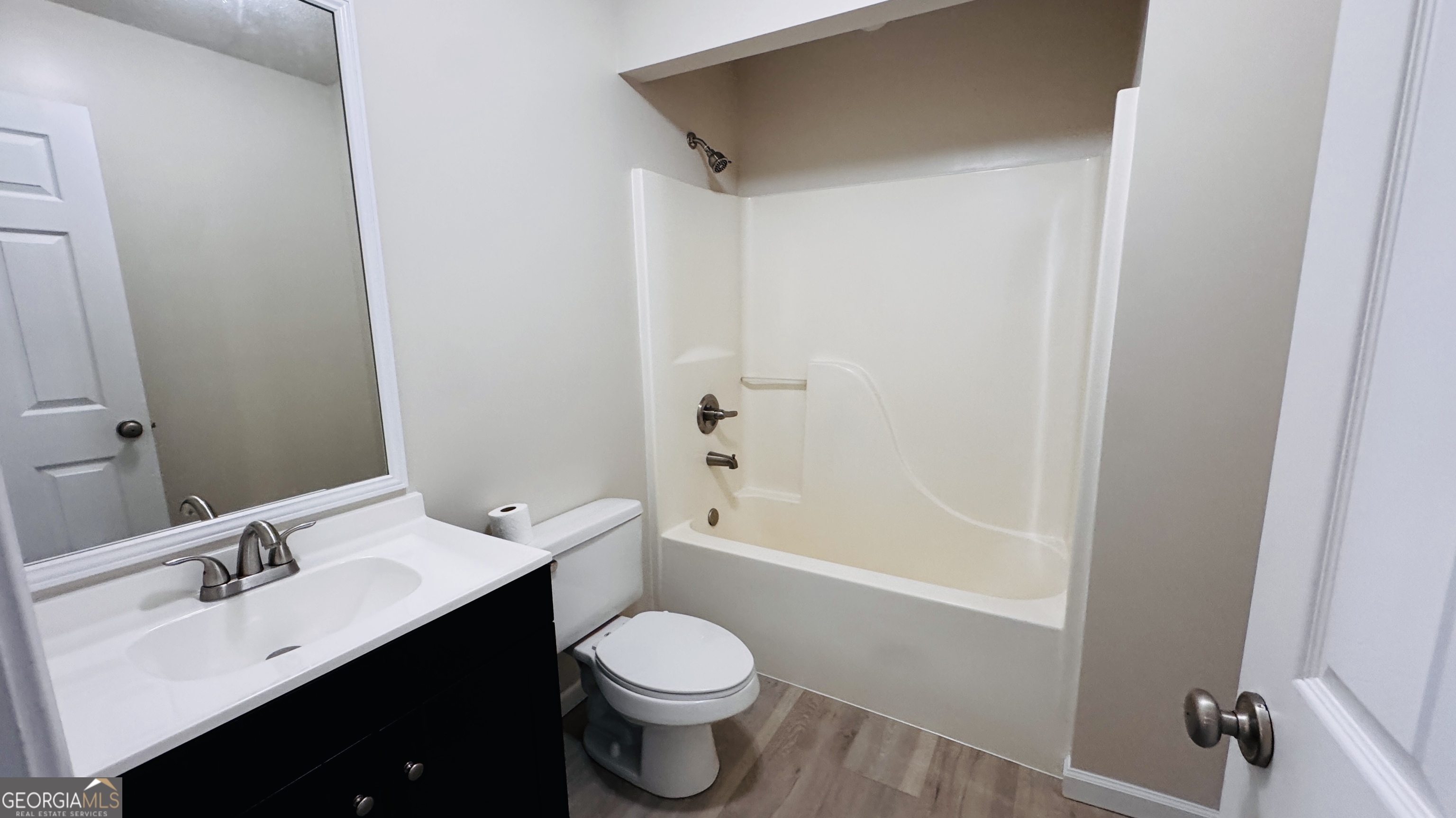 512 Antietum Road Collins, GA 30421 - Photo 13 of 16 a bathroom with a bathtub shower sink vanity mirror and toilet