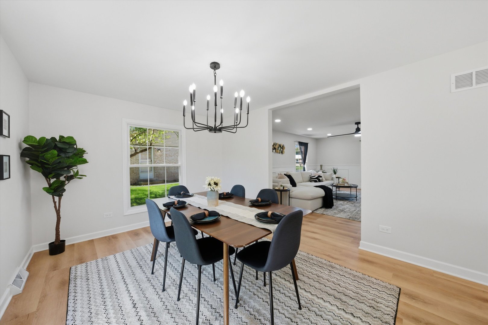 2932 Polly Lane Flossmoor, IL 60422 - Photo 17 of 53 a view of a dining room with furniture a chandelier and wooden floor