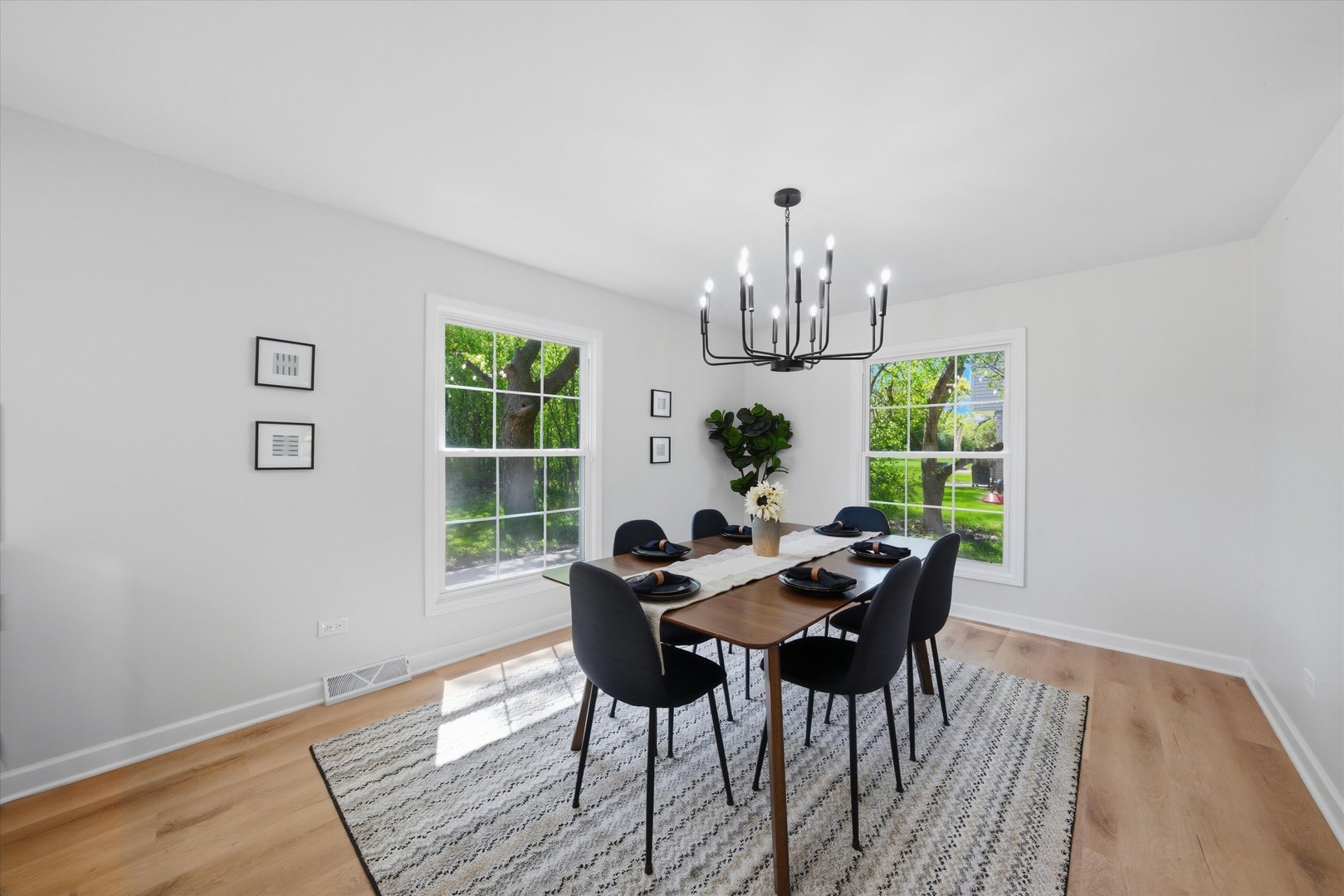 2932 Polly Lane Flossmoor, IL 60422 - Photo 18 of 53 a view of a dining room with furniture a chandelier and wooden floor