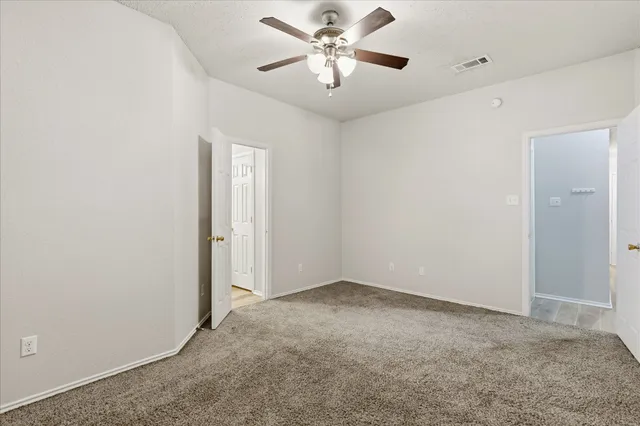 a bathroom with a double vanity sink toilet and shower