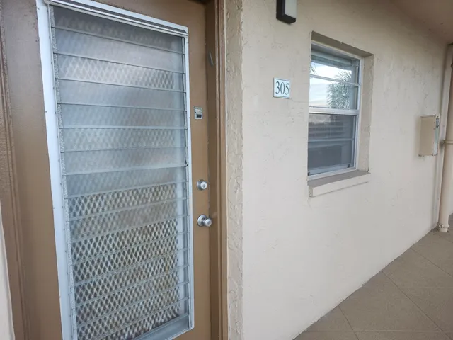 a front view of a house with garage