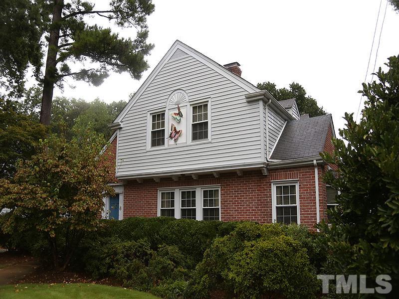 2404 White Oak Road Raleigh, NC 27609 - Photo 1 of 23 a front view of a house with plants and trees